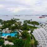 a pool and a building by the water