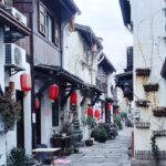 a row of buildings with red lanterns