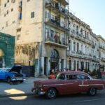 an old car parked on the side of the road