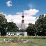 Sapporo TV tower surrounded by trees and buildings