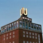 brown and black concrete building under blue sky during daytime
