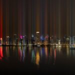 city skyline with lights turned on during night time