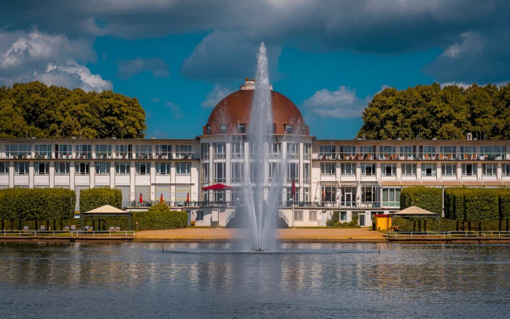 A large building with a fountain in front of it