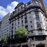 a very tall building sitting next to a traffic light
