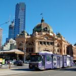 cars on road near brown concrete building during daytime
