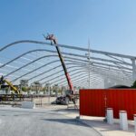 a large metal structure with a crane on top of it