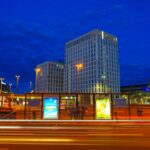City buildings at night with light trails