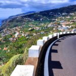 a winding road with a view of the ocean