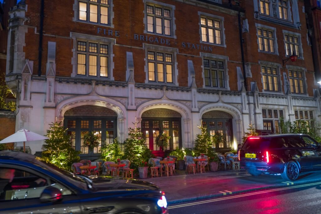 A large building with cars parked in front of it