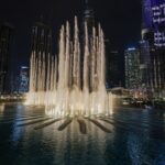 a large fountain of water in the middle of a city