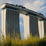 a couple of tall buildings sitting next to each other