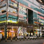 A busy city street with tall buildings.