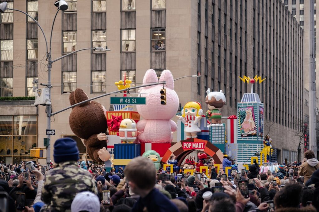 Parade float with cartoon characters and balloons.