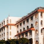 a large white building with a red roof