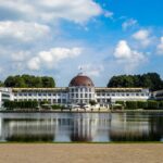 Grand building with dome reflected in water