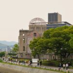 A river running through a city next to a bridge