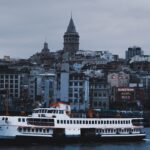 a large white boat floating on top of a body of water