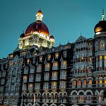 a large building lit up at night with lights on