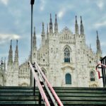 a very tall building with a clock on it's side