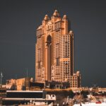 a very tall building with a lot of boats in front of it