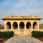A large building with a fountain in front of it